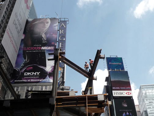 Skydancer - a film by Katja Esson Sky Fox and his son Leo on top of steel structure at New York City's Time Square